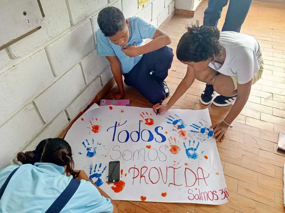 Students making a pro-life sign for their LIFE Team — youth-led pro-life student group